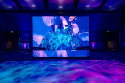 “The DJ booth façade was a challenge—we had to get every angle just right, [thinking] how would it look from the sides and back, and how would it look with the LED screen behind it,” said Taylor. “We carefully crafted each shard in our warehouse with foam core to test how many we would need for the height and dimension. We realized when building this that the DJ booth needed a custom table size, which we built and used to mount the shards to the front of the structure.”