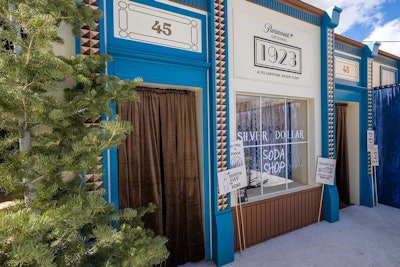 In a village-inspired area, guests could journey back in time by visiting the Silver Dollar Soda Shoppe from the series 1923, where a 1920s-era photographer—equipped with props and Prohibition-era garments—took their photos.