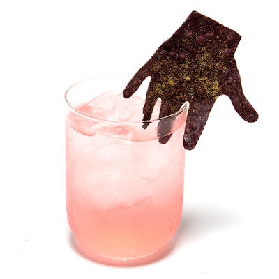 Here's a slightly different take on a go-to fall flavor: New York-based Pinch Food Design's fun 'corny margarita⁠' made with tequila blanco, corn liquor, lime, and a blue corn 'hand' chip on the side.