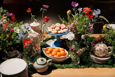New York-based company Mary Giuliani Catering & Events draws on its founder's theater background to tell stories through food, like with this lush, floral-filled food display that incorporated a pretty spring-inspired tea set.