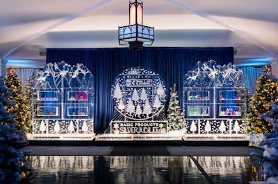 In late 2023, school and office supplies company Bazic Products hosted a glamorous 'Silver Jubilee'—complete with pencils, paper clips, and more products as decor—to mark 25 years in business. Designer and producer Sterling Engagements incorporated Bazic Products throughout the space—including frozen inside a 20-foot ice wall fabricated by Ice Bulb. Products like colorful Bazic scissors also served as ornaments on snow-dusted evergreen trees.
