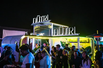 As for food and beverage, “open bars were stocked with top-shelf liquor,” and bottles were delivered to tables via galley carts in a nod to the Catch Me If You Can theme. Signature drinks were available courtesy of event partner Jose Cuervo—there was even a Jose Cuervo-branded fuselage on-site for a fun photo op—as well as bites from Raising Cane’s and Crumbl cookies. Fever Tree, Rémy Martin, Heineken, Pepsi, Ciroc, Nutrl, Red Bull, and Prizepicks also participated in F&B offerings.
