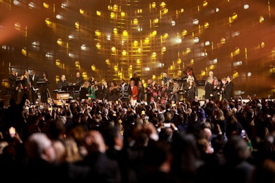 Artists like Melissa Etheridge, Bruce Springsteen, Shania Twain, and The Goo Goo Dolls performed tributes to Bon Jovi’s legacy. The event was produced by live event broadcast outfit Lewis & Clark, made up of Joe Lewis and R.A. Clark, with Rob Mathes as musical director.